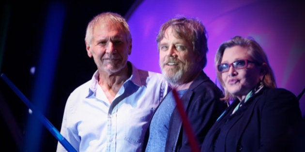 SAN DIEGO, CA - JULY 10: (EDITORS NOTE: This image was processed using digital filters.) (L-R) Actors Harrison Ford, Mark Hamill, Carrie Fisher and more than 6000 fans enjoyed a surprise 'Star Wars' Fan Concert performed by the San Diego Symphony, featuring the classic 'Star Wars' music of composer John Williams, at the Embarcadero Marina Park South on July 10, 2015 in San Diego, California. (Photo by Jesse Grant/Getty Images for Disney)