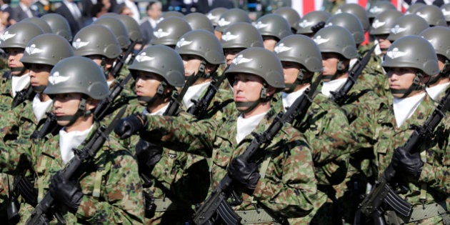 FILE - In this Oct. 27, 2013 file photo, members of Japan Self-Defense Forces march during the Self-Defense Forces Day at Asaka Base, north of Tokyo. Several Asian nations are arming up, their wary eyes fixed squarely on one country: a resurgent China thatâs boldly asserting its territorial claims all along the East Asian coast. The scramble to spend more defense dollars comes amid spats with China over contested reefs and waters. Other Asian countries such as India and South Korea are quickly modernizing their forces, although their disputes with China have stayed largely at the diplomatic level. (AP Photo/Shizuo Kambayashi, File)