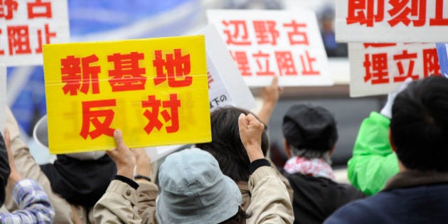 OKINAWA, JAPAN - FEBRUARY 01: People gather in front of the US Marines Camp Schwab in Okinawa, Japan to protest against the construction of the new US base at Henoko in Okinawa, Japan, on February 01, 2015. (Photo by David Mareuil/Anadolu Agency/Getty Images)