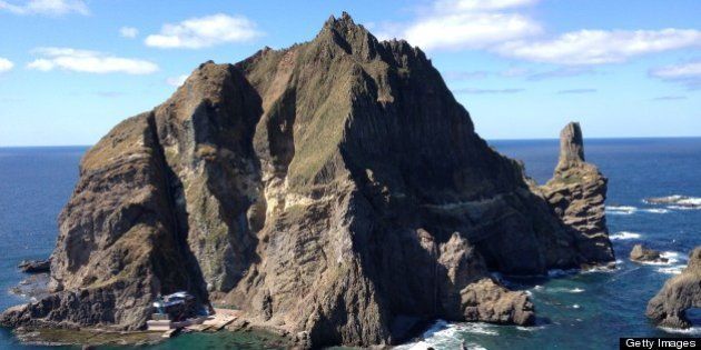 DOKDO/TAKESHIMA ISLANDS, SOUTH KOREA - OCTOBER 4: A fisherman and his wife live at the base of the taller of Dokdo's main two islands, in South Korea on October 4, 2012. (Photo by Chico Harlan/The Washington Post via Getty Images)