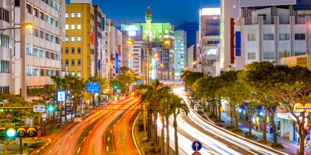 Naha, Okinawa, Japan downtown cityscape over the expressway.