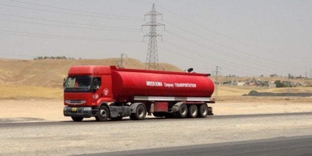 Oil tankers transport petrol sold by IS (Islamic State) to Kurdish business men on July 12, 2014, in Iraq's disputed northern city of Kirkuk. Iraq's Kurdish region claimed disputed northern oilfields in another blow to efforts to forge a united front against a jihadist-led onslaught, as twin bombings killed 28 people. AFP PHOTO/MARWAN IBRAHIM (Photo credit should read MARWAN IBRAHIM/AFP/Getty Images)