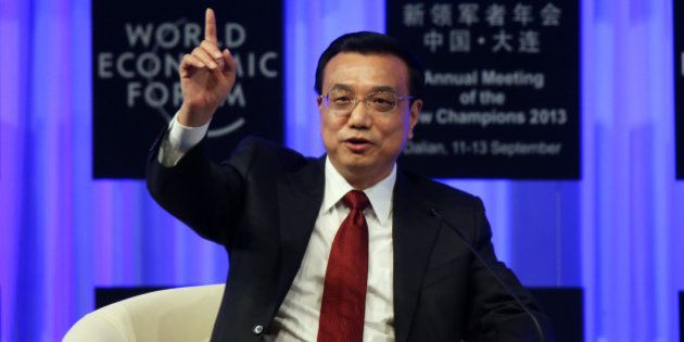 Li Keqiang, China's premier, gestures as he speaks during the opening plenary at the World Economic Forum Annual Meeting of The New Champions in Dalian, China, on Wednesday, Sept. 11, 2013. Li said the foundations of a growth rebound aren't solid while cautioning that stimulus won't help resolve deep-rooted issues in the world's second-largest economy. Photographer: Tomohiro Ohsumi/Bloomberg via Getty Imagesg