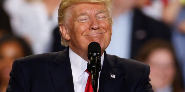 U.S. President Donald Trump appears on stage at a rally in Harrisburg, Pennsylvania, U.S. April 29, 2017. REUTERS/Carlo Allegri TPX IMAGES OF THE DAY