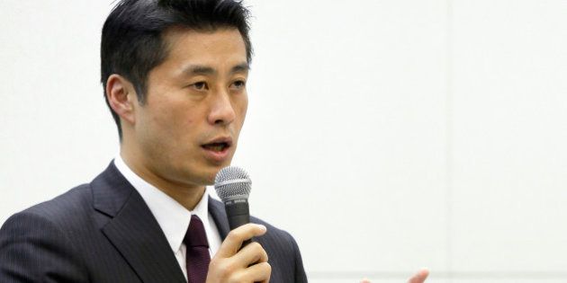 Goshi Hosono, Japan's environment minister, left, speaks as Toshio Nishizawa, president of Tokyo Electric Power Co. (Tepco), far right, listens during a news conference at the company's headquarters in Tokyo, Japan, on Friday, Dec. 16, 2011. Japanese Prime Minister Yoshihiko Noda said the government and Tokyo Electric Power Co. have completed a cold shutdown of the Fukushima nuclear reactors crippled by the March 11 record earthquake and tsunami. Photographer: Kiyoshi Ota/Bloomberg via Getty Images