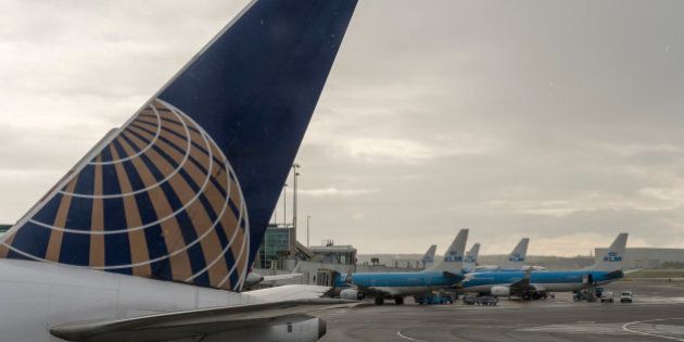 AMSTERDAM, NETHERLANDS - APRIL 23: A United Airlines and several KLM airplanes are parked on the tarmac in Schiphol Airport on April 23, 2017 in Amsterdam, Netherlands. Schiphol is the main international airport of the Netherlands. It is the third busiest airport in Europe in terms of passengers, and the hub for KLM and its regional affiliate KLM Cityhopper as well as for Corendon Dutch Airlines, Martinair, Transavia and TUI fly Netherlands. The airport also serves as a European hub for Delta Air Lines and Jet Airways and as a base for EasyJet and Vueling. (Photo by Horacio Villalobos - Corbis/Corbis via Getty Images)
