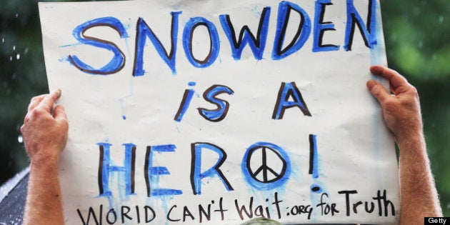 NEW YORK, NY - JUNE 10: A supporter holds a sign at a small rally in support of National Security Administration (NSA) whistleblower Edward Snowden in Manhattan's Union Square on June 10, 2013 in New York City. About 15 supporters attended the rally a day after Snowden's identity was revealed in the leak of the existence of NSA data mining operations. (Photo by Mario Tama/Getty Images)