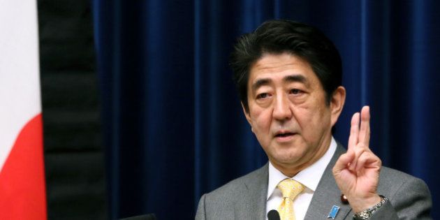 Shinzo Abe, Japan's prime minister, gestures as he speaks during a news conference at the prime minister's official residence in Tokyo, Japan, on Monday, March 10, 2014. Japan's economy expanded less than estimated in the fourth quarter and the current-account deficit widened to a record in January, highlighting risks to Abenomics as a sales-tax increase looms. Photographer: Haruyoshi Yamaguchi/Bloomberg via Getty Images
