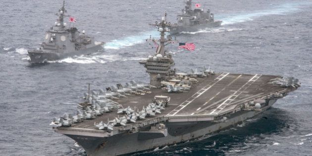 The U.S. Navy aircraft carrier USS Carl Vinson leads the Japan Maritime Self-Defense Force (JMSDF) Atago-class guided-missile destroyer JS Ashigara (L) followed by the JMSDF Murasame-class destroyer JS Samidare during a transit of the Philippine Sea April 26, 2017. U.S. Navy/Mass Communication Specialist 2nd Class Sean M. Castellano/Handout via REUTERS TPX IMAGES OF THE DAY.FOR EDITORIAL USE ONLY. NOT FOR SALE FOR MARKETING OR ADVERTISING CAMPAIGNSTHIS IMAGE HAS BEEN SUPPLIED BY A THIRD PARTY. IT IS DISTRIBUTED, EXACTLY AS RECEIVED BY REUTERS, AS A SERVICE TO CLIENTS