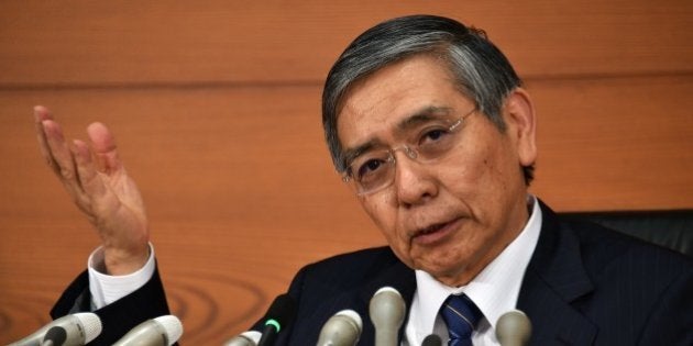 Bank of Japan (BOJ) Governor Haruhiko Kuroda speaks to the press at the BOJ headquarters in Tokyo on October 31, 2014. The BOJ ramped up its vast monetary easing programme following a string of poor data that has fanned fears the economy may contract again in the third quarter. AFP PHOTO / Yoshikazu TSUNO (Photo credit should read YOSHIKAZU TSUNO/AFP/Getty Images)