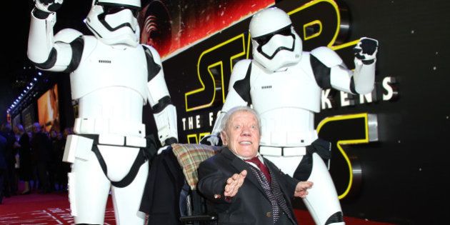 Kenny Baker, centre, poses for photographers upon arrival at the European premiere of the film 'Star Wars: The Force Awakens ' in London, Wednesday, Dec. 16, 2015. (Photo by Joel Ryan/Invision/AP)