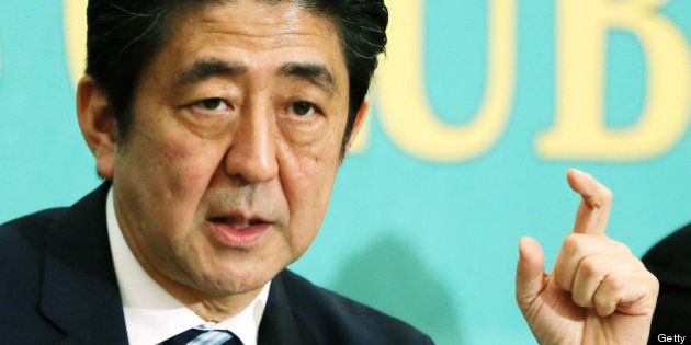 Shinzo Abe, Japan's prime minister and president of the Liberal Democratic Party (LDP), gestures as he speaks during a debate at the Japan National Press Club in Tokyo, Japan, on Wednesday, July 3, 2013. Abe called for laws, not force-based order, in the Asia region during a televised debate with leaders of other political parties in Tokyo today ahead of the July 21 upper house election. Photographer: Haruyoshi Yamaguchi/Bloomberg via Getty Images