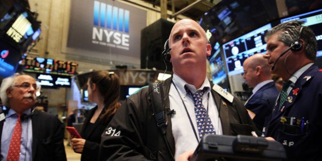 NEW YORK, NY - JULY 08: Traders wait for trading to resume on the floor of the New York Stock Exchange (NYSE) after trading was halted due to a 'technical glitch' on July 8, 2015 in New York City. Trading was to resume in the afternoon. (Photo by Spencer Platt/Getty Images)