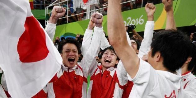 2016 Rio Olympics - Artistic Gymnastics - Final - Men's Team Final - Rio Olympic Arena - Rio de Janeiro, Brazil - 08/08/2016. Japan gymnasts celebrate winning the men's team final. REUTERS/Dylan Martinez FOR EDITORIAL USE ONLY. NOT FOR SALE FOR MARKETING OR ADVERTISING CAMPAIGNS.