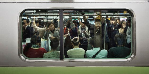 A crowded Tokyo Yamanote Line commuter train during a busy period on Saturday when people go out to shop