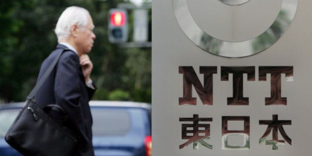 A man walks by a corporate sign of Nippon Telegraph and Telephone (NTT) East Corp. at its headquarters in Tokyo Tuesday May 13, 2008. Japan's top telecommunications company NTT Corp. said Tuesday its group net profit surged 32 percent for the fiscal 2007 on booming long distance and international communications business. (AP Photo/Koji Sasahara)