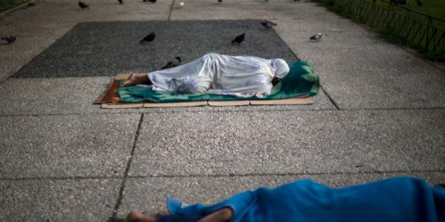 Homeless sleep on the ground in central Athens, Monday, July 6, 2015. Greeceâs finance minister has resigned following Sundayâs referendum in which the majority of voters said ânoâ to more austerity measures in exchange for another financial bailout. (AP Photo/Emilio Morenatti)
