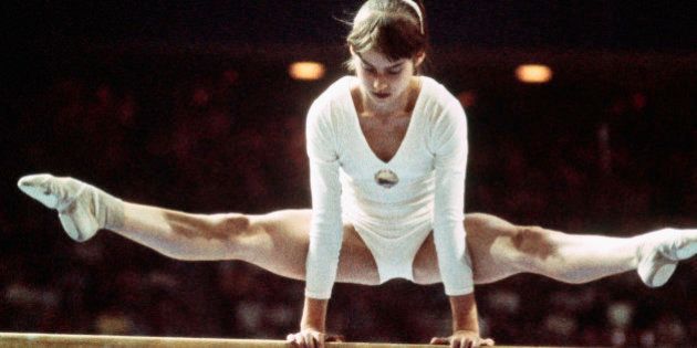 (Original Caption) Nadia Comaneci, the 14 year old gymnastic sensation from Romania, demonstrates her balance during her routine on the balance beam at the 1976 Summer Olympics in Montreal, Canada.