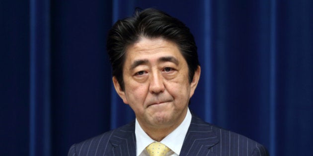 Shinzo Abe, Japan's prime minister, listens during a news conference at the prime minister's official residence in Tokyo, Japan, on Wednesday, June 26, 2013. Abe wants to focus on the economy for the next three years, he said today at a news conference in Tokyo marking the end of a parliamentary session. Photographer: Tomohiro Ohsumi/Bloomberg via Getty Images