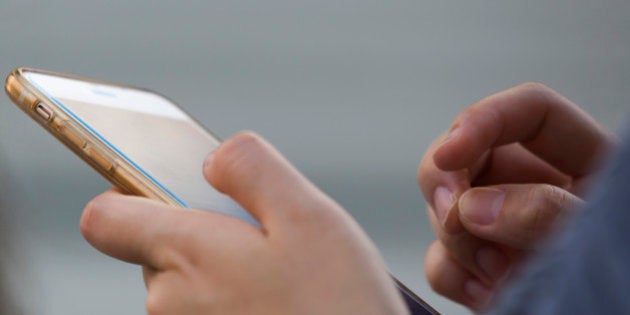 TOKYO, JAPAN - JULY 11: A man uses a smartphone on July 11, 2016 in Tokyo, Japan. Japanese messaging app provider LINE Corp., owned by South Korean portal Naver Corp., announced it has set the price of its initial public offering at 35 million shares at 3,300 yen apiece on Monday. The company expects to list on the New York Stock Exchange on July 14 and also on the Tokyo Stock Exchange on July 15. (Photo by Tomohiro Ohsumi/Getty Images)