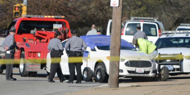 Crews remove the car of a fugitive, who police said posted a video of himself on Facebook killing an elderly man in Cleveland, after he shot and killed himself following a brief police pursuit in Erie, Pennsylvania, U.S. April 18, 2017. REUTERS/Alan Freed