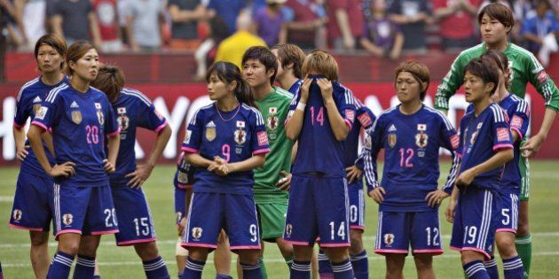 Members of the Japan team react to losing the championship match against the USA at BC Place Stadium during the 2015 FIFA Women's World Cup in Vancouver on July 5, 2015. AFP PHOTO/ANDY CLARK (Photo credit should read ANDY CLARK/AFP/Getty Images)