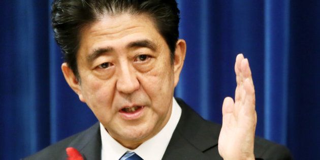 Shinzo Abe, Japan's prime minister, gestures during a news conference at the prime minister's official residence in Tokyo, Japan, on Tuesday, Oct. 1, 2013. Abe proceeded with an April sales-tax increase and will implement a stimulus program as he tries to rein in the world's biggest debt burden without jeopardizing efforts to end deflation. Photographer: Haruyoshi Yamaguchi/Bloomberg via Getty Images