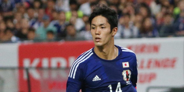 SAPPORO, JAPAN - SEPTEMBER 05: Yoshinori Muto of Japan runs with the ball during the KIRIN CHALLENGE CUP 2014 international friendly match between Japan and Uruguay at Sapporo Dome on September 5, 2014 in Sapporo, Japan. (Photo by Atsushi Tomura/Getty Images)