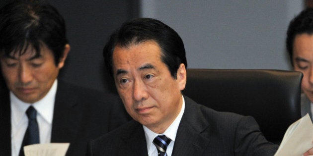 (FILES) This file picture taken on May 28, 2012 shows former Japanese prime minister Naoto Kan (C) speaking at a parliamentary commission in Tokyo probing the Fukushima nuclear disaster. A parliamentary probe into the nuclear disaster at Fukushima will publish its final report on July 5, 2012, and is expected to say Japan's last prime minister fanned chaos in the opening days of the crisis. AFP PHOTO / FILES / Yoshikazu TSUNO (Photo credit should read YOSHIKAZU TSUNO/AFP/GettyImages)