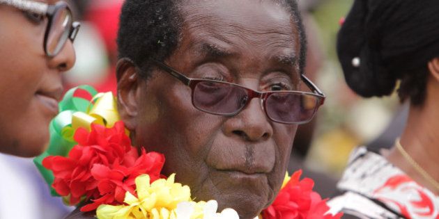 President Robert Mugabe is seen during celebrations to mark his 91st birthday in the resort town of Victoria Falls, Zimbabwe, Saturday Feb, 28, 2015. Mugabe turned 91 on the 21st of February and become the world's oldest leader, with his supporters saying they will back him to run his full term until 2018 - despite questions about his health and an economy that is crumbling under his watch. (AP Photo/Tsvangirayi Mukwazhi)