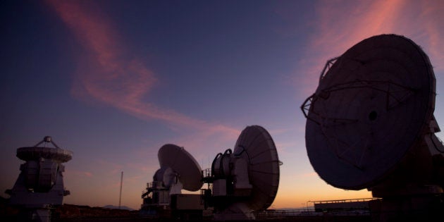 Radio telescope antennas of the ALMA ( Atacama Large Millimeter/submillimeter Array) project are seen in the Chajnantor plateau, Atacama desert, some 1500 km north of Santiago, on March 12,2013. The ALMA, an international partnership project between Europe, North America and East Asia, with the cooperation of Chile, is presently the largest astronomical project in the world. On March 13, 66 high precision antennas will be opened, located at an altitude of 5000 meters above sea level in the extremely arid Atacama desert. AFP PHOTO/Martin BERNETTI (Photo credit should read MARTIN BERNETTI/AFP/Getty Images)