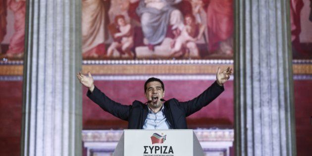 Leader of Syriza left-wing party Alexis Tsipras speaks to his supporters outside Athens University Headquarters, Sunday, Jan. 25, 2015. A triumphant Alexis Tsipras told Greeks that his radical left Syriza party's win in Sunday's early general election meant an end to austerity and humiliation and that the country's regular and often fraught debt inspections were a thing of the past.
