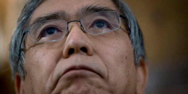 Haruhiko Kuroda, governor of the Bank of Japan (BOJ), listens at an event at the Council On Foreign Relations in New York, U.S., on Thursday, Oct. 10, 2013. Kuroda said the bank will do what is necessary to defeat deflation, while declining to discuss specific additional measures it might take. Photographer: Scott Eells/Bloomberg via Getty Images