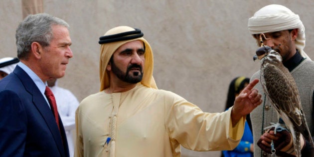 US President George W. Bush, left, listens to United Arab Emirates Vice President Mohammed bin Rashid Al Maktoum, center, pointing to a falcon during a visit to the Sheikh Saeed Al Maktoum House, Monday, Jan. 14, 2008 in Dubai, United Arab Emirates. (AP Photo/Pablo Martinez Monsivais)