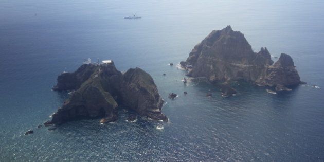 An aerial view of the remote islands disputed with Japan, known as Dokdo in Korea and Takeshima in Japan, in the Sea of Japan (East Sea) on August 10, 2012. South Korean President Lee Myung-Bak paid the unprecedented visit to the remote islands disputed with Japan, sparking anger in Tokyo which recalled its ambassador from Seoul in protest. The South has stationed a small coastguard detachment since 1954 on the islands, whose ownership has been disputed for decades between South Korea and its former colonial ruler Japan. REPUBLIC OF KOREA OUT AFP PHOTO / DONG-A ILBO (Photo credit should read DONG-A ILBO/AFP/GettyImages)