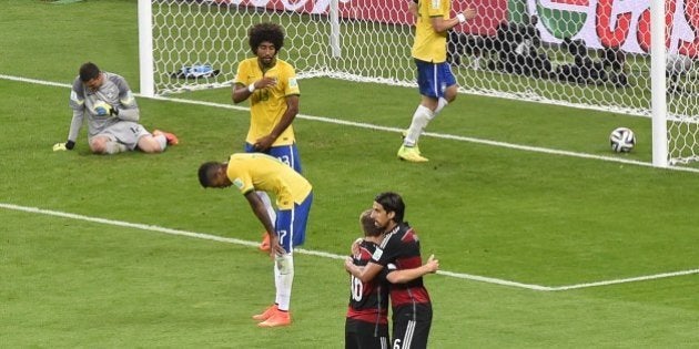 Brazil's goalkeeper Julio Cesar (L) reacts after failing to stop Germany's forward Andre Schuerrle scoring his first goal during the semi-final football match between Brazil and Germany at The Mineirao Stadium in Belo Horizonte on July 8, 2014, during the 2014 FIFA World Cup. AFP PHOTO / ODD ANDERSEN (Photo credit should read ODD ANDERSEN/AFP/Getty Images)