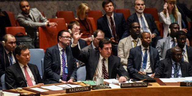 Russian Deputy Ambassador to the United Nations Vladimir Safronkov votes against a draft resolution condemning the reported use of chemical weapons in Syria at the Security Council meeting on the situation in Syria at the United Nations Headquarters in New York, U.S., April 12, 2017. REUTERS/Stephanie Keith
