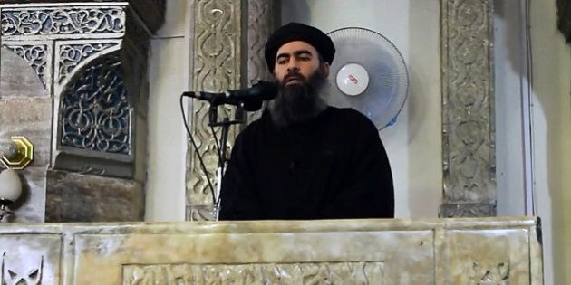 MOSUL, IRAQ - JULY 5 : An image grab taken from a video released on July 5, 2014 by Al-Furqan Media shows alleged Islamic State of Iraq and the Levant (ISIL) leader Abu Bakr al-Baghdadi preaching during Friday prayer at a mosque in Mosul.(Photo by Al-Furqan Media/Anadolu Agency/Getty Images)