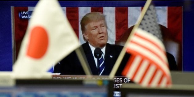 A TV monitor displays a broadcast of the congressional speech by US President Donald Trump at a foreign exchange brokerage in Tokyo on March 1, 2017. Tokyo shares ended the morning session higher, but the key indexes pared some early gains as investors kept a close eye on President Trump's congressional speech for fresh details on his economic growth plans. / AFP / TORU YAMANAKA (Photo credit should read TORU YAMANAKA/AFP/Getty Images)