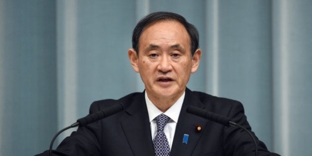 Japanese Chief Cabinet Secretary Yoshihide Suga answers questions during a press conference at the prime minister's official residence in Tokyo January 21, 2015. Japanese Prime Minister Shinzo Abe was rushing home from the Middle East to take charge of Tokyo's response after Islamic militants threatened to kill two nationals unless he pays a 200 million USD ransom. AFP PHOTO / Toru YAMANAKA (Photo credit should read TORU YAMANAKA/AFP/Getty Images)