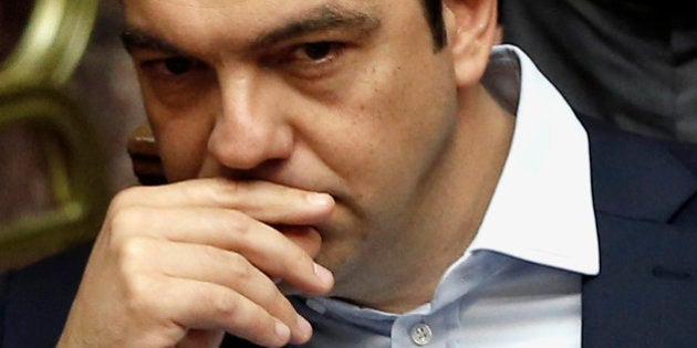 Greece's Prime Minister Alexis Tsipras attends an emergency Parliament session for the governmentâs proposed referendum in Athens, Saturday, June 27, 2015. After five months of fruitless negotiations, relations between Greece and its creditors crumbled further Saturday after Prime Minister Tsipras stunned them by calling for a referendum on the proposed reforms needed to get bailout loans. (AP Photo/Petros Karadjias)