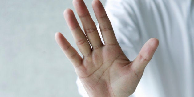 Businessman making hand gesture,close up