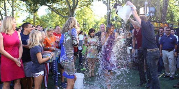 GOOD MORNING AMERICA - The GMA team gets soaked taking the Ice Bucket Challenge, promoting awareness of ALS, on GOOD MORNING AMERICA, 8/15/14, airing on the ABC Television Network. (Photo by Fred Lee/ABC via Getty Images) LARA SPENCER, GINGER ZEE