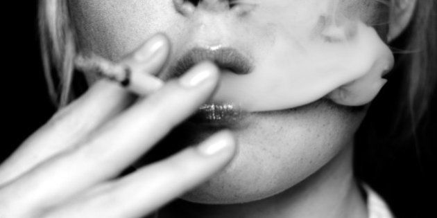 Young Woman Smoking Cigarette, Black and White