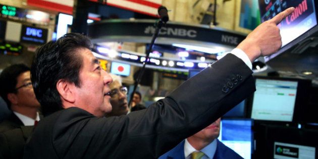 NEW YORK, NY - SEPTEMBER 25: (CHINA OUT, SOUTH KOREA OUT) Japanese Prime Minister Shinzo Abe visits to the New York Stock Exchange on September 25, 2013 in New York. Abe spoke on 'Abenomics' and Japan's economic recovery. (Photo by The Asahi Shimbun via Getty Images)