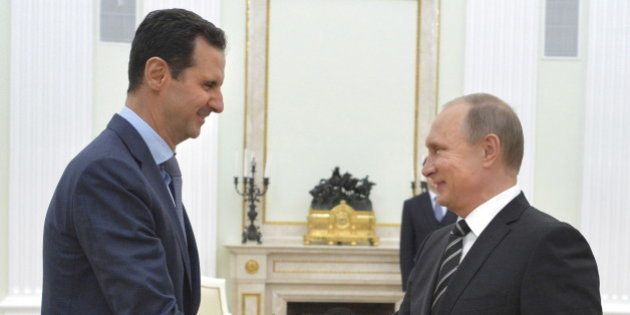 Russian President Vladimir Putin (R) shakes hands with Syrian President Bashar al-Assad during a meeting at the Kremlin in Moscow, Russia, October 20, 2015. Assad flew to Moscow on Tuesday evening to personally thank Putin for his military support, in a surprise visit that underlined how Russia has become a major player in the Middle East. Picture taken October 20, 2015. REUTERS/Alexei Druzhinin/RIA Novosti/Kremlin ATTENTION EDITORS - THIS IMAGE HAS BEEN SUPPLIED BY A THIRD PARTY. IT IS DISTRIBUTED, EXACTLY AS RECEIVED BY REUTERS, AS A SERVICE TO CLIENTS.