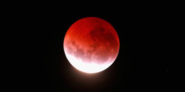 AUCKLAND, NEW ZEALAND - APRIL 04: A blood red moon lights up the sky during a total lunar eclipse on April 4, 2015 in Auckland, New Zealand. The shortest total lunar eclipse, or 'blood moon', of the century will last just a few minutes. (Photo by Phil Walter/Getty Images)