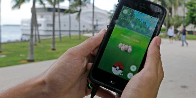 Exeggcute, a Pokemon, is found by a Pokemon Go player, Tuesday, July 12, 2016, at Bayfront Park in downtown Miami. The