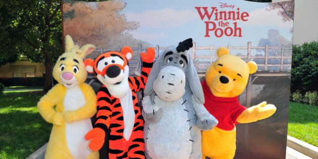 Rabbit, Tigger, Eeyore and Winnie the Pooh pose at Walt Disney Pictures presents the premiere of 'Winnie The Pooh' at Walt Disney Studios on July 10, 2011 in Burbank, California.