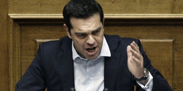 Greek Prime Minister Alexis Tsipras delivers a speech during a parliamentary session in Athens on June 28, 2015. Greece will hold a referendum on July 5 on the outcome of negotiations with its international creditors taking place in Brussels today. AFP PHOTO / ANGELOS TZORTZINIS (Photo credit should read ANGELOS TZORTZINIS/AFP/Getty Images)